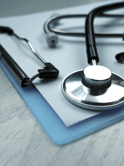 stethoscope and medical instruments on a clipboard